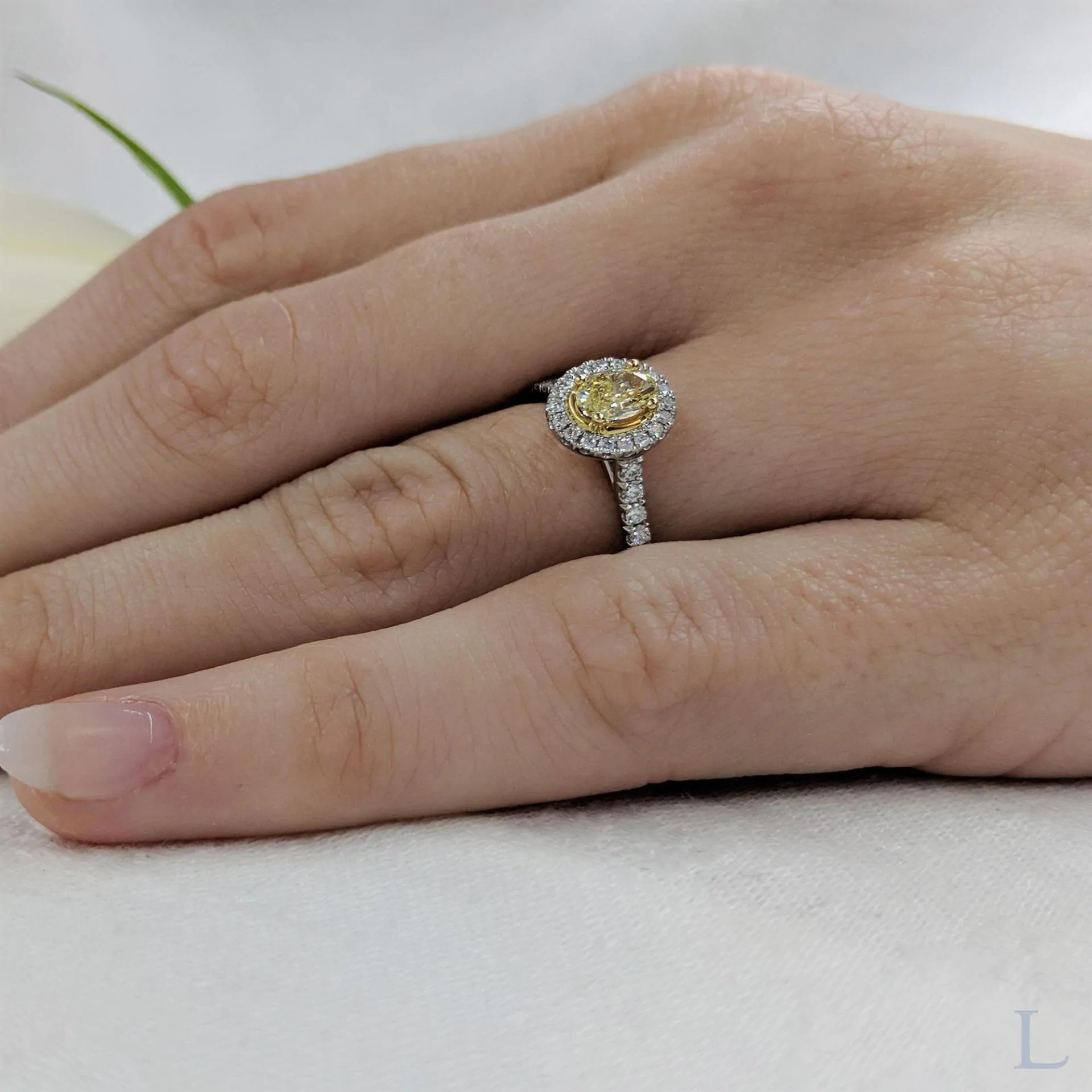 Platinum & 18ct Yellow Gold 0.52ct FY SI2 Oval Cut Yellow Diamond and Diamond Halo Ring