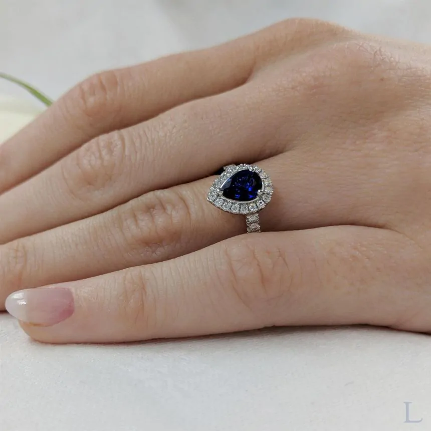 Platinum 0.95ct Pear Shape Cut Sapphire and Diamond Halo Ring
