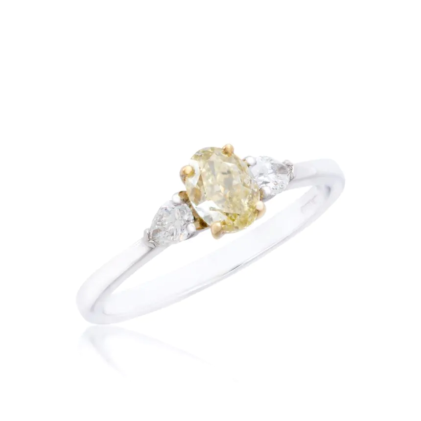 Platinum 0.61ct oval cut yellow diamond three stone ring