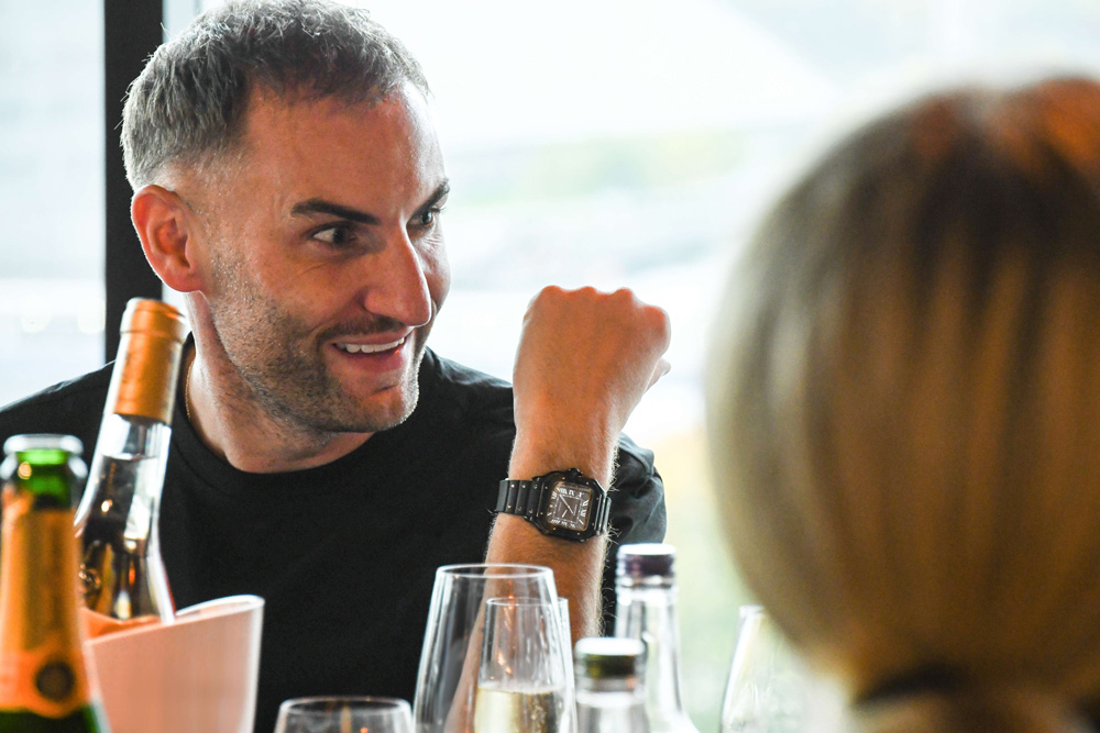 An influencer wearing a pre-owned Cartier Santos watch