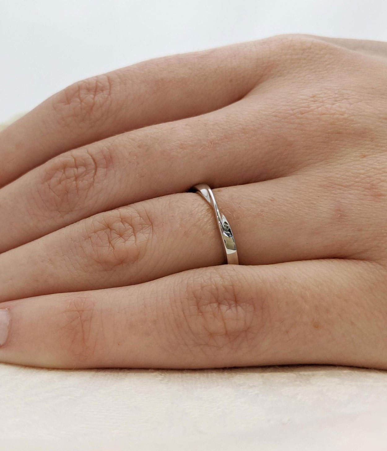 An platinum wedding band.