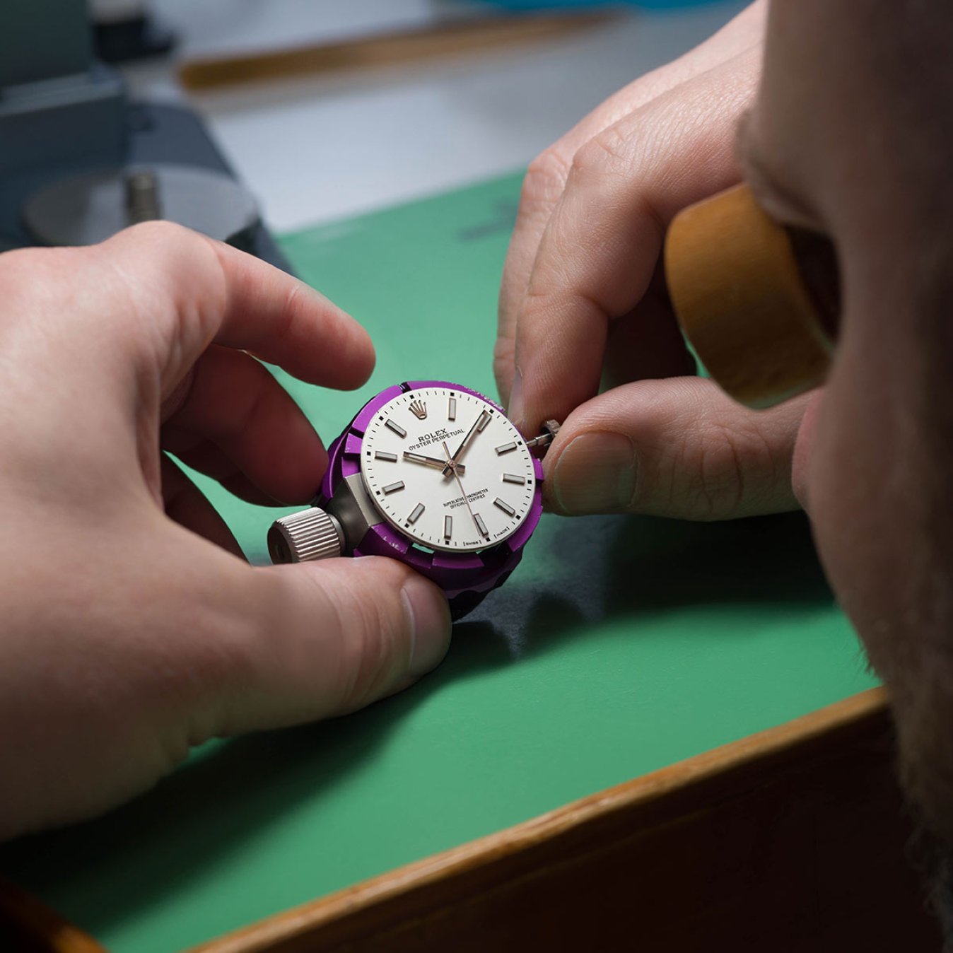 Rolex Accredited Watchmaker Working on a Dial