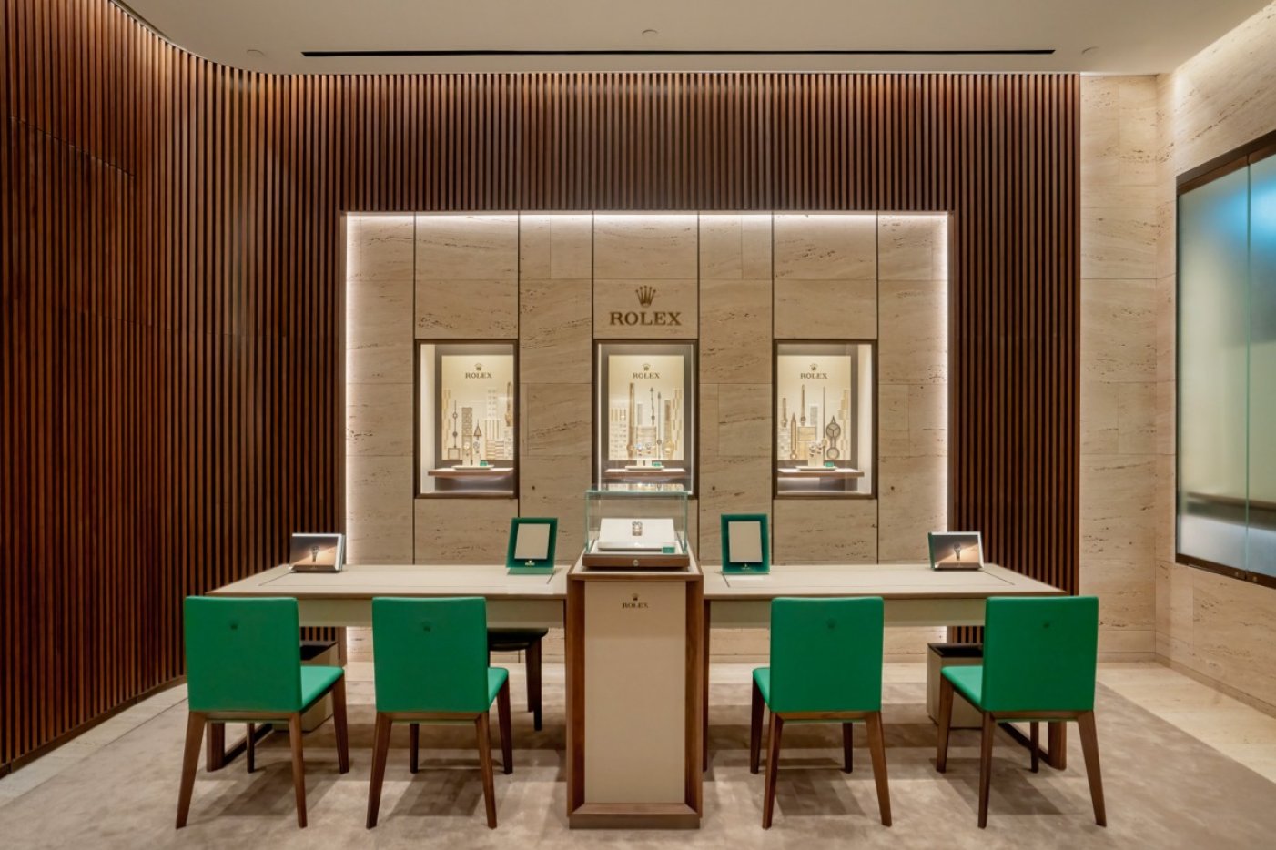 View of a Laings Rolex showroom with green and gold accents