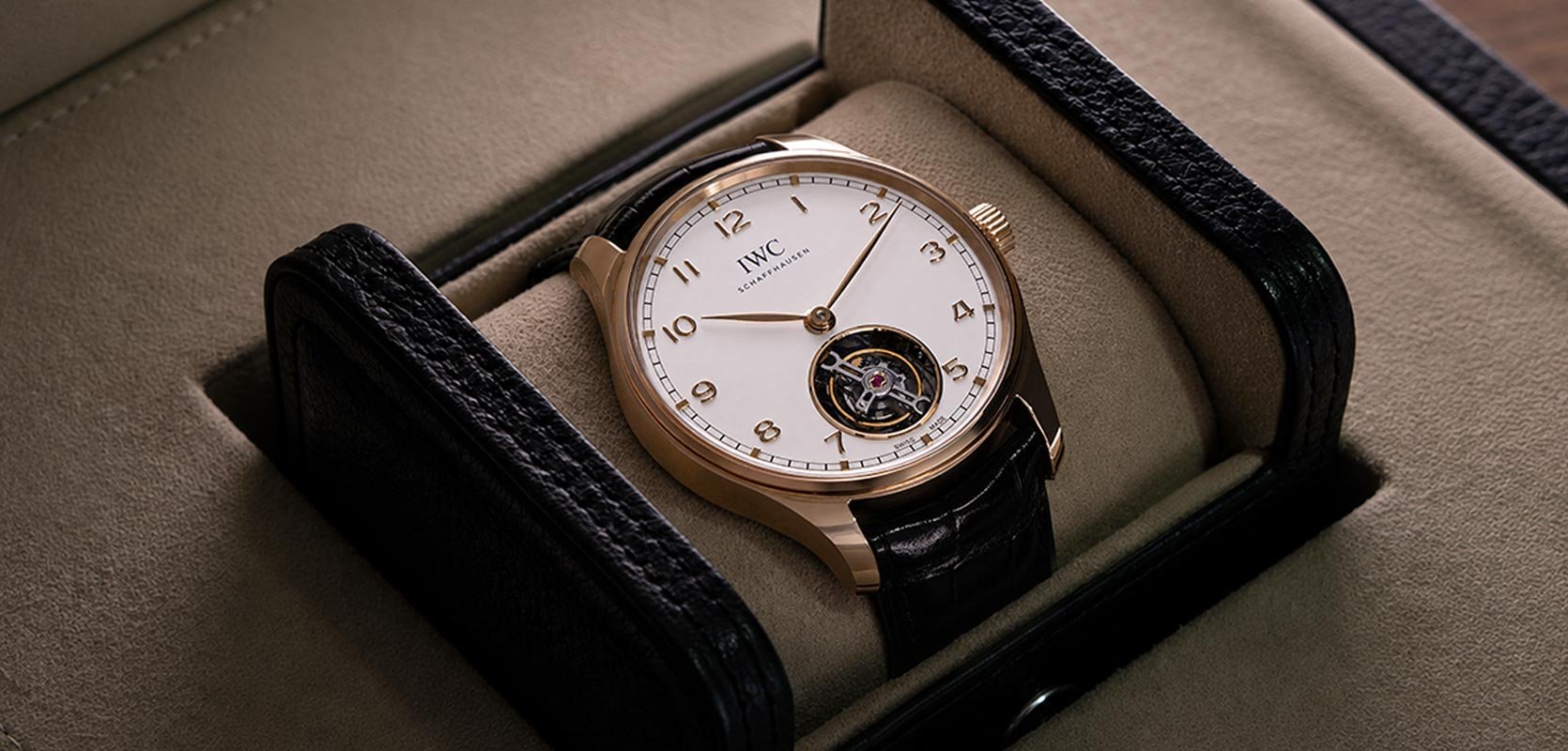Pre-Owned IWC with gold case and numerals on a white dial 