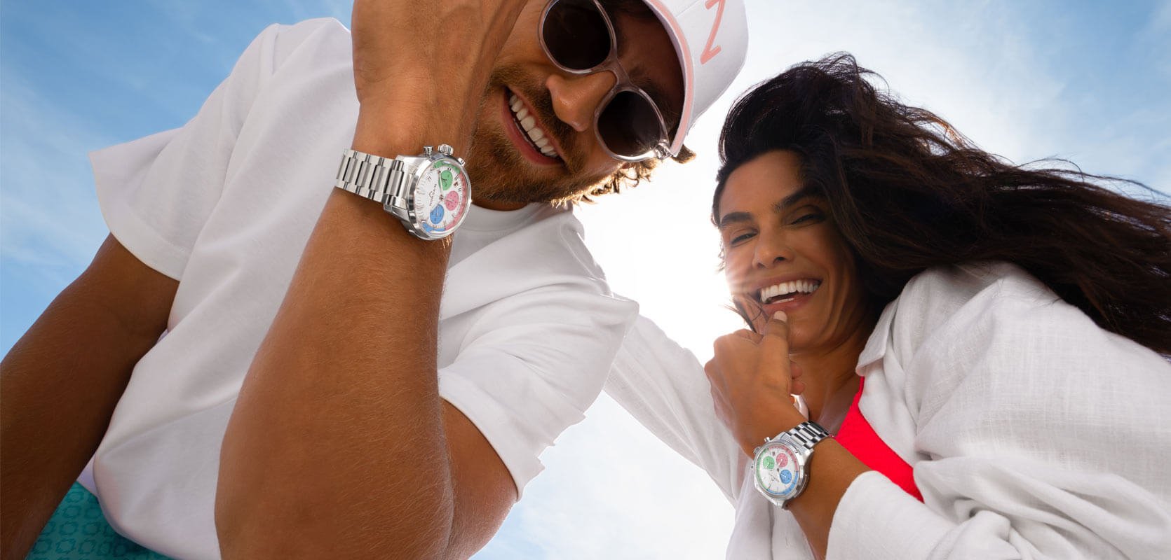 NORQAIN Enjoy Life watches featuring steel bracelets white dials with colourful subdials