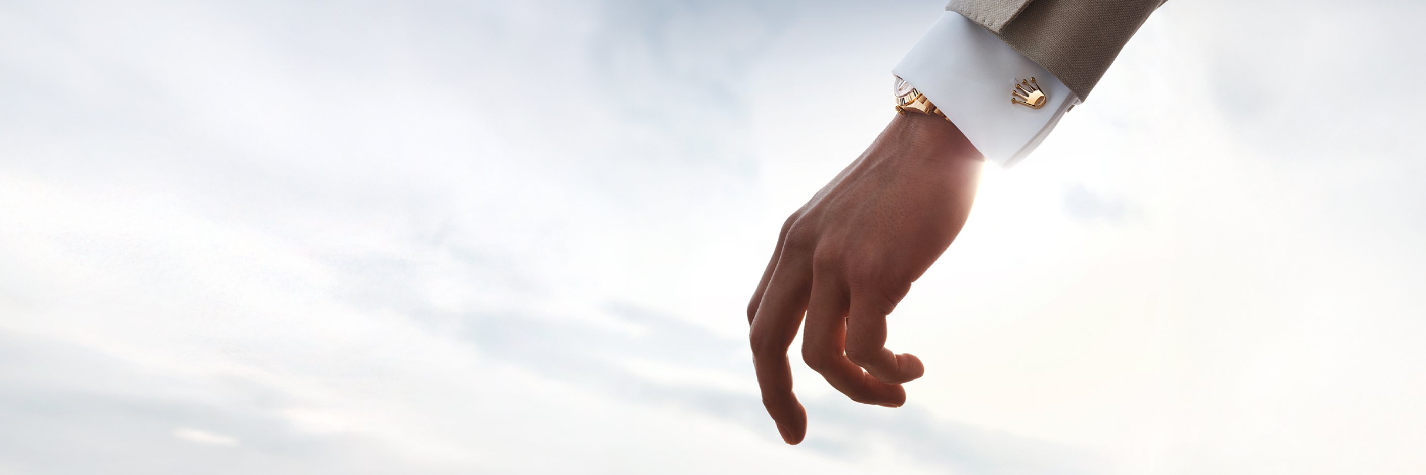 Rolex Accessories - Close-up of sleeve with Rolex 'crown' cufflinks in 18 ct Gold