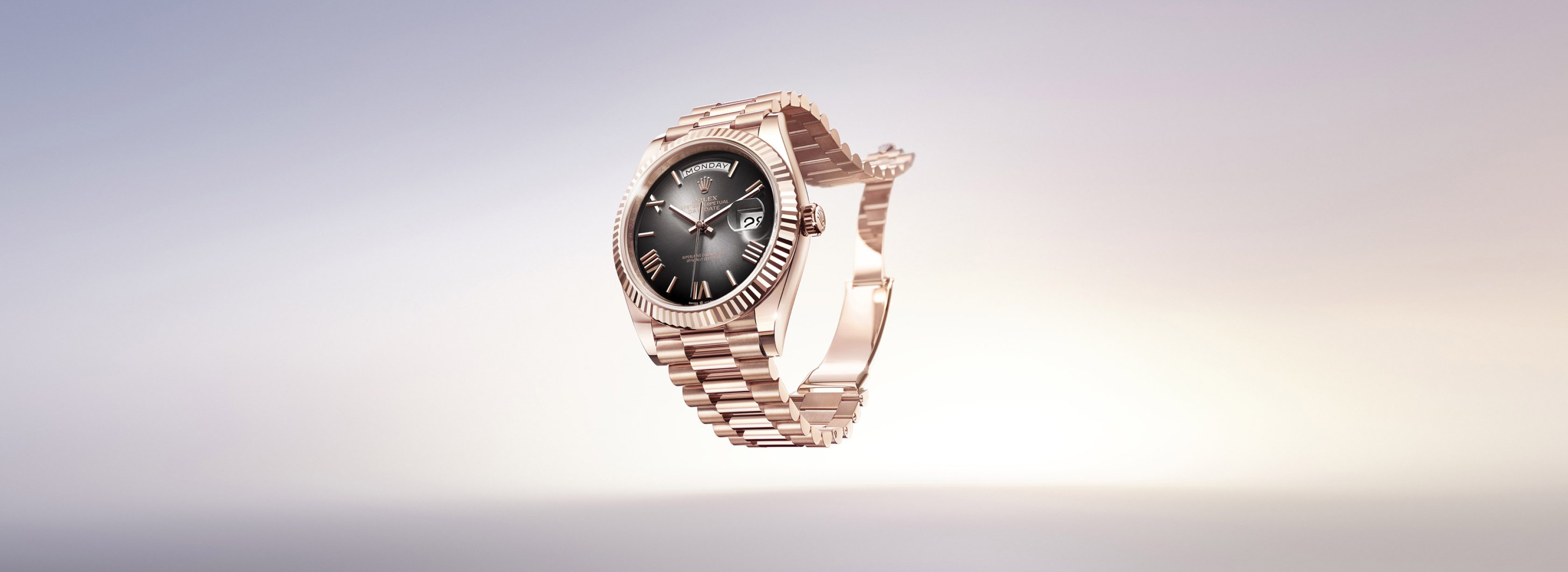 Rolex Day-Date watch in Everose Gold and Black Dial.