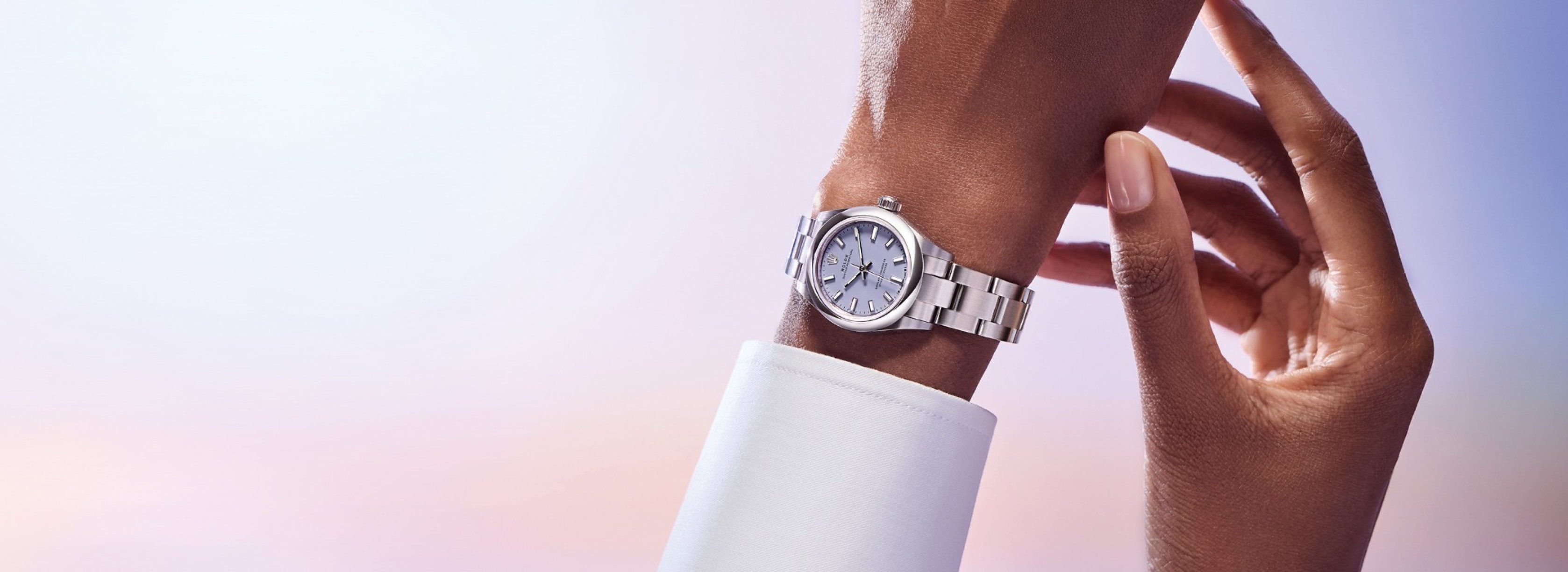 Rolex Oyster Perpetual Watch with a lavender dial on wrist