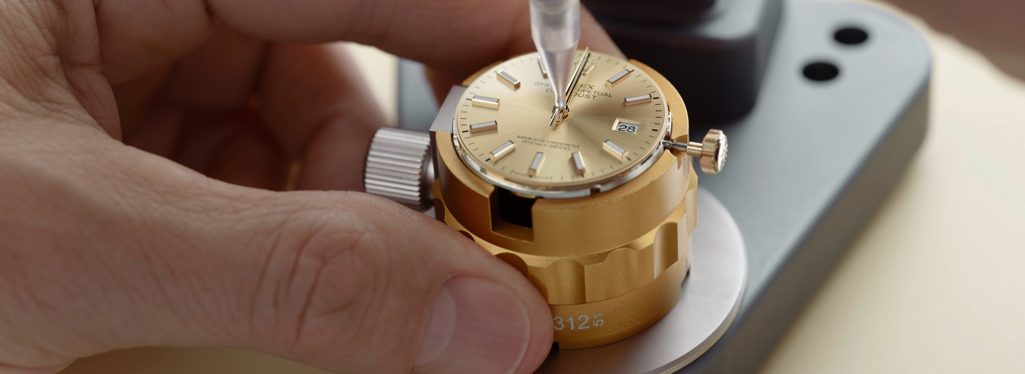A dial being worked on in the service centre at Rolex