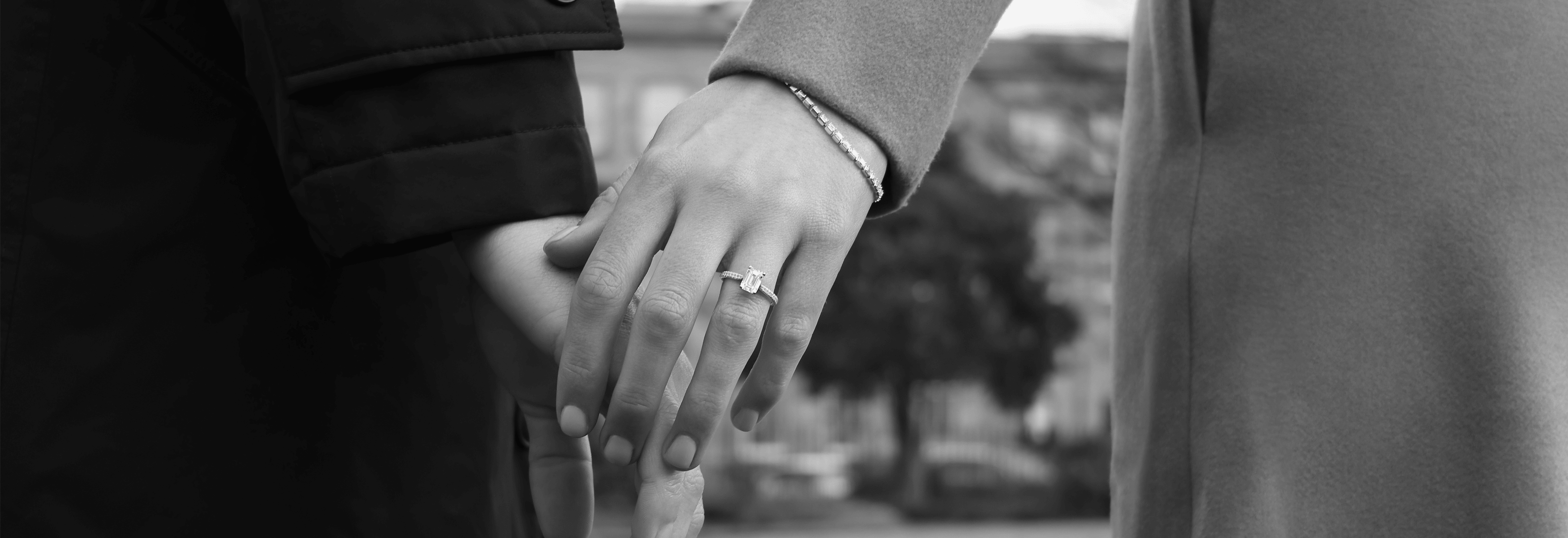 Emerald cut engagement ring with diamond shoulders