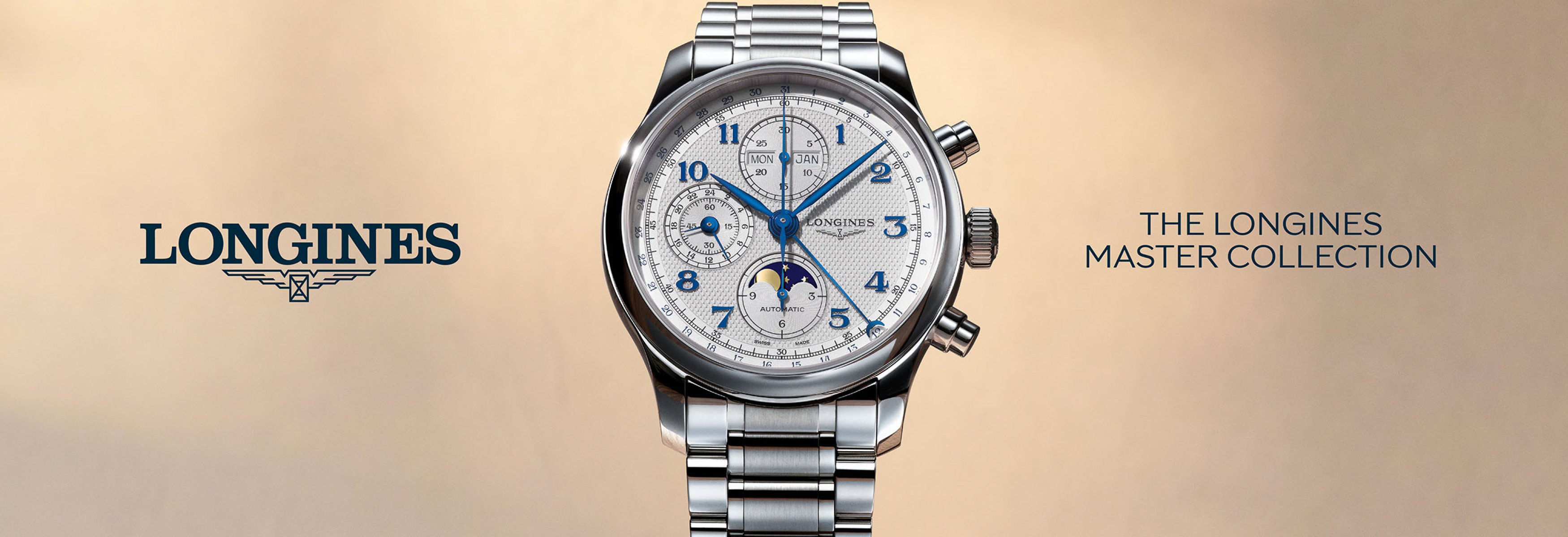A close up image of a Longines master collection 41mm watch with a steel case and bracelet, a white dial and blue hour markers. 