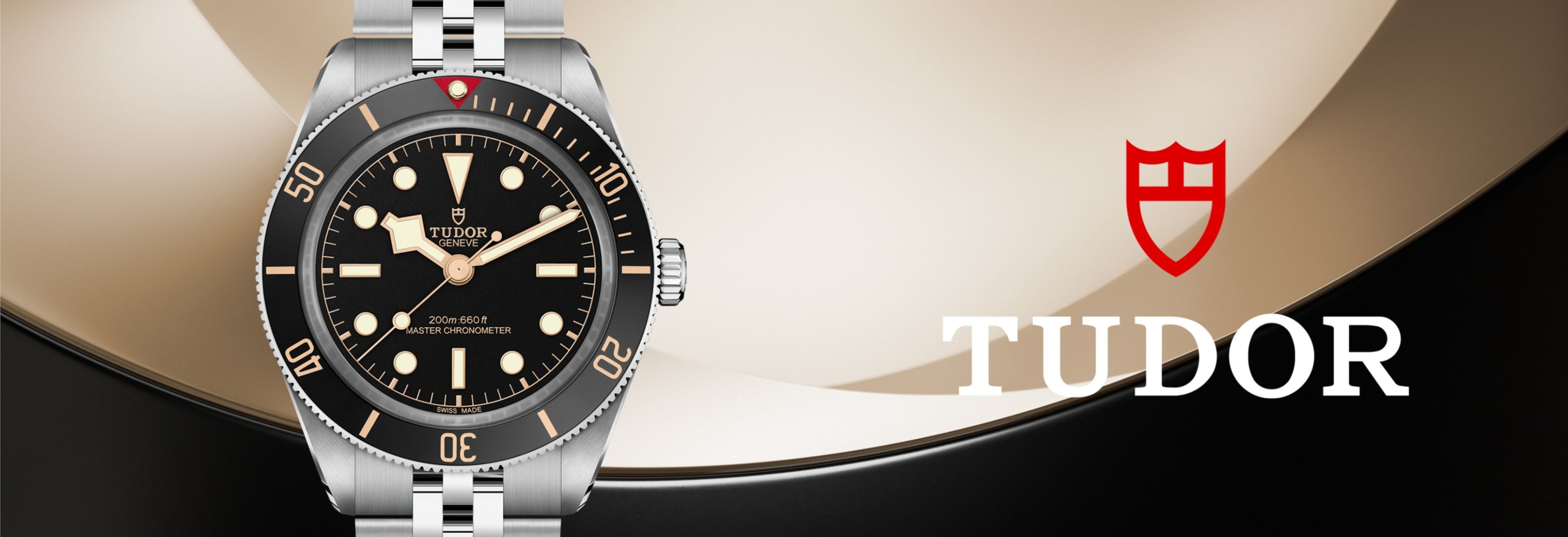 TUDOR Black Bay watch with a blue dial and bezel on a stainless steel bracelet, set against a poolside backdrop.