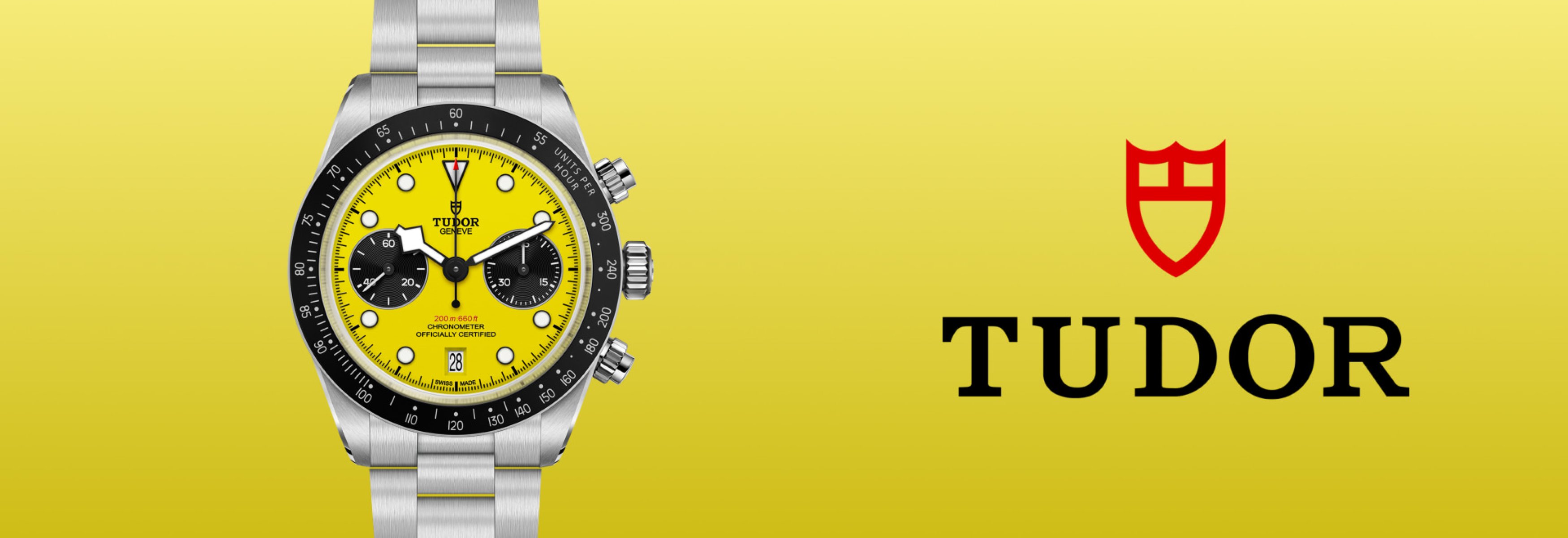 A stainless steel TUDOR Black Bay 39 wristwatch with a yellow dial is shown against a yellow background