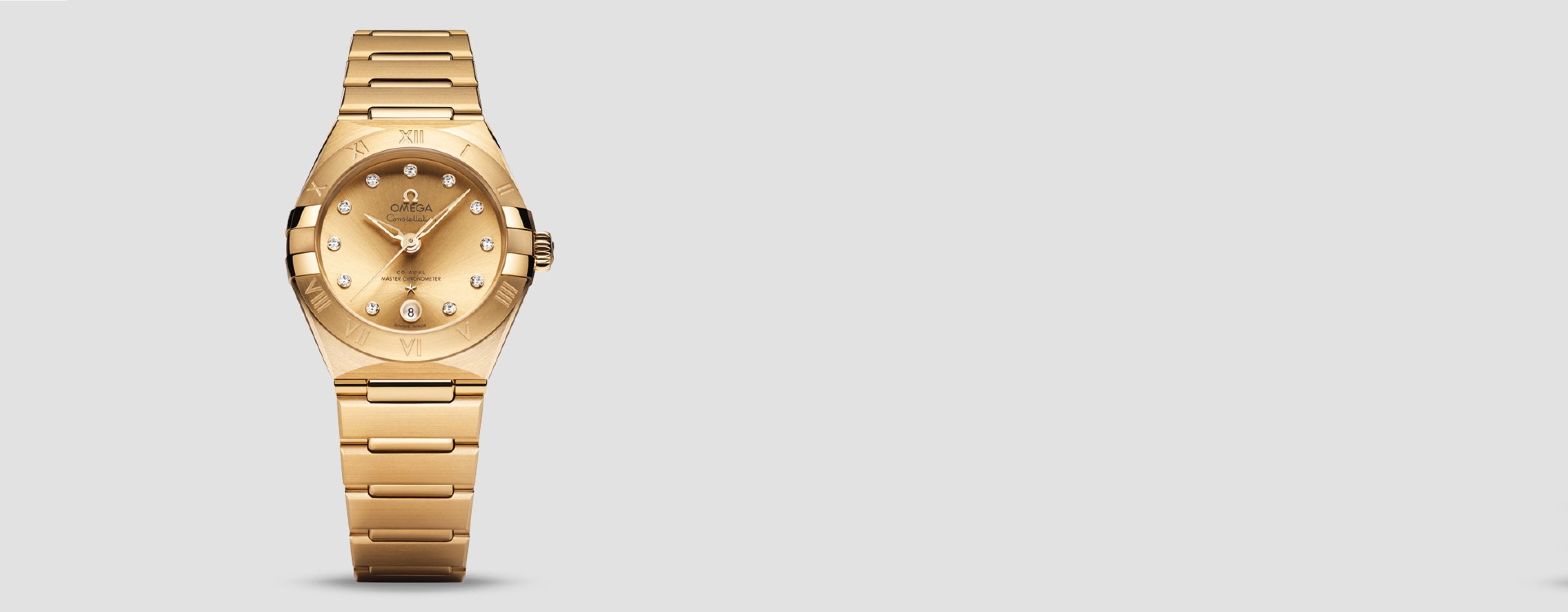 OMEGA Constellation watch in full 18ct yellow gold with a diamond -set champagne dial and date window.