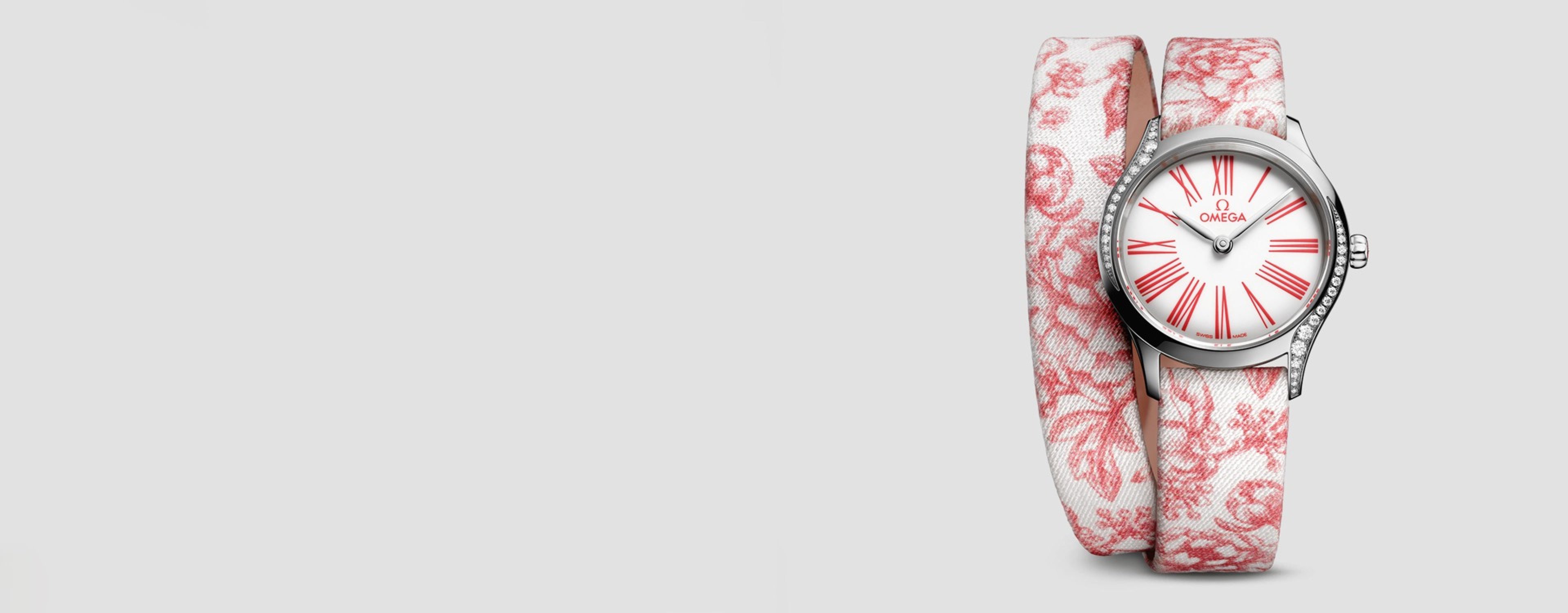OMEGA De Ville Watch with a white dial, red numerals and a fabric toile de jouy patterned strap