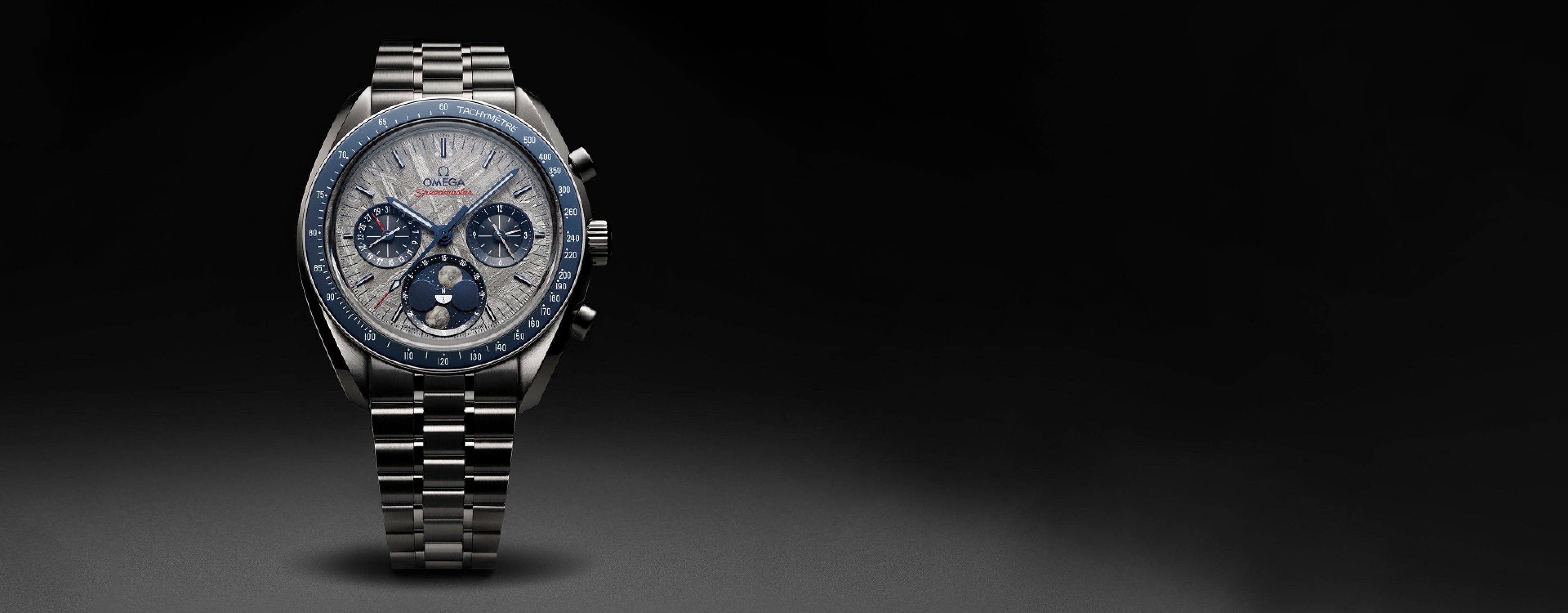 OMEGA Speedmaster Moonphase watch in steel with a meteorite dial and blue ceramic bezel.