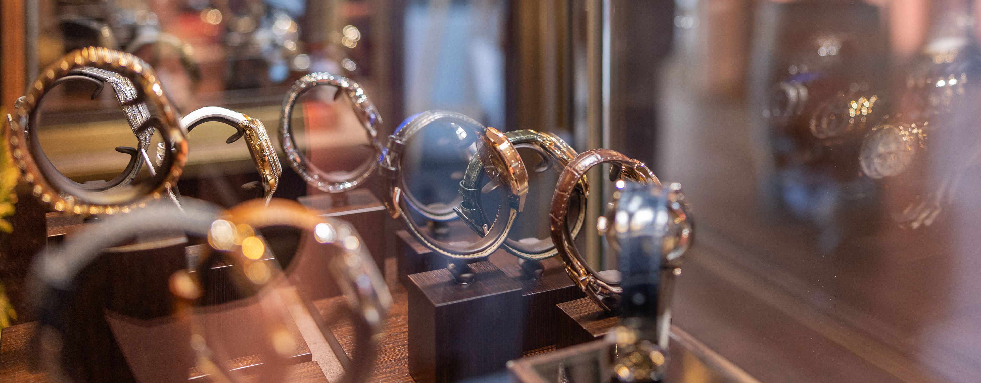 Patek Philippe watches in a display case.