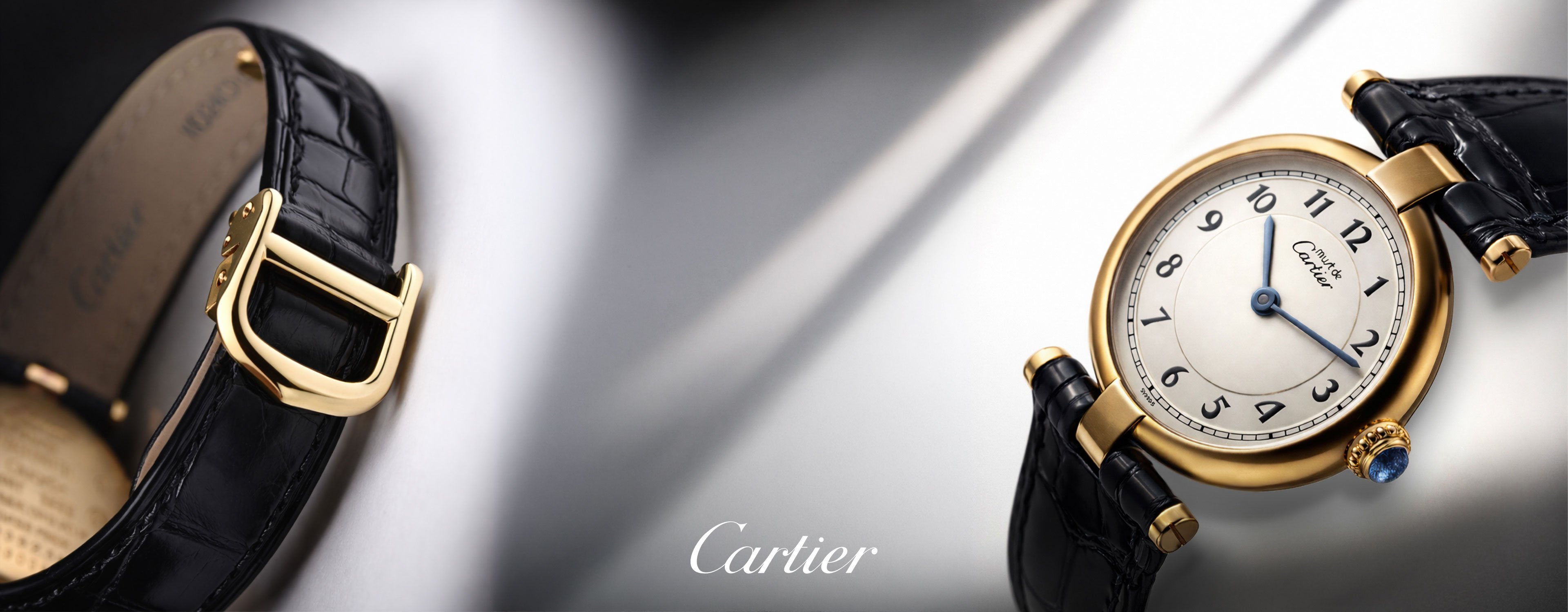 A pre-owned Must de Cartier watch with a gold case and a black leather strap