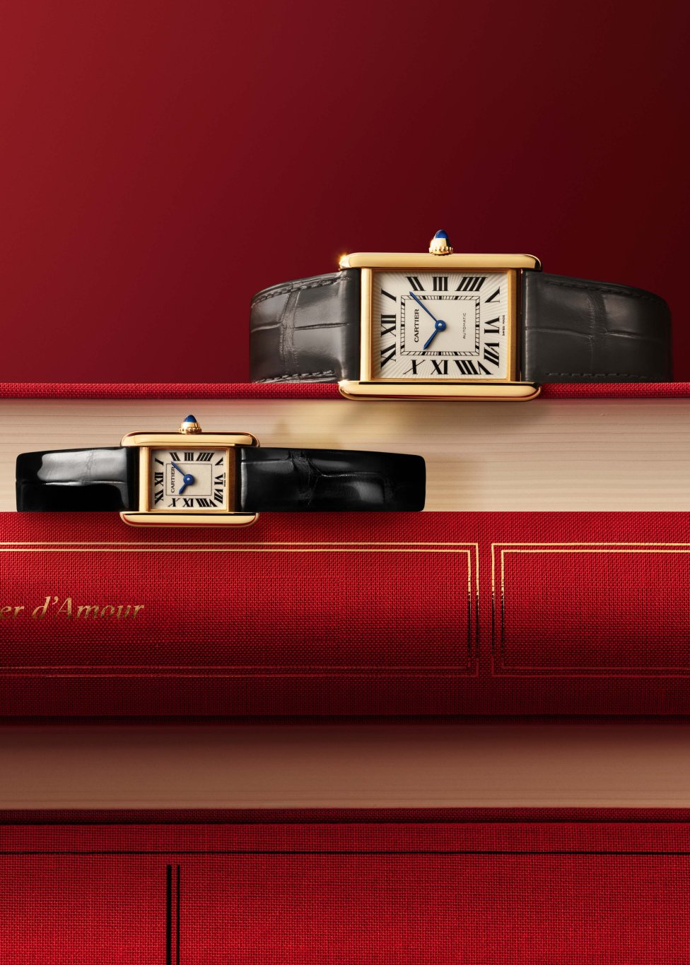 Cartier wristwatch with a rectangular gold case, black leather strap, Roman numerals, and blue hands. The watch face displays the text 'CARTIER' at the top center, set against a warm-toned geometric background with shadows.