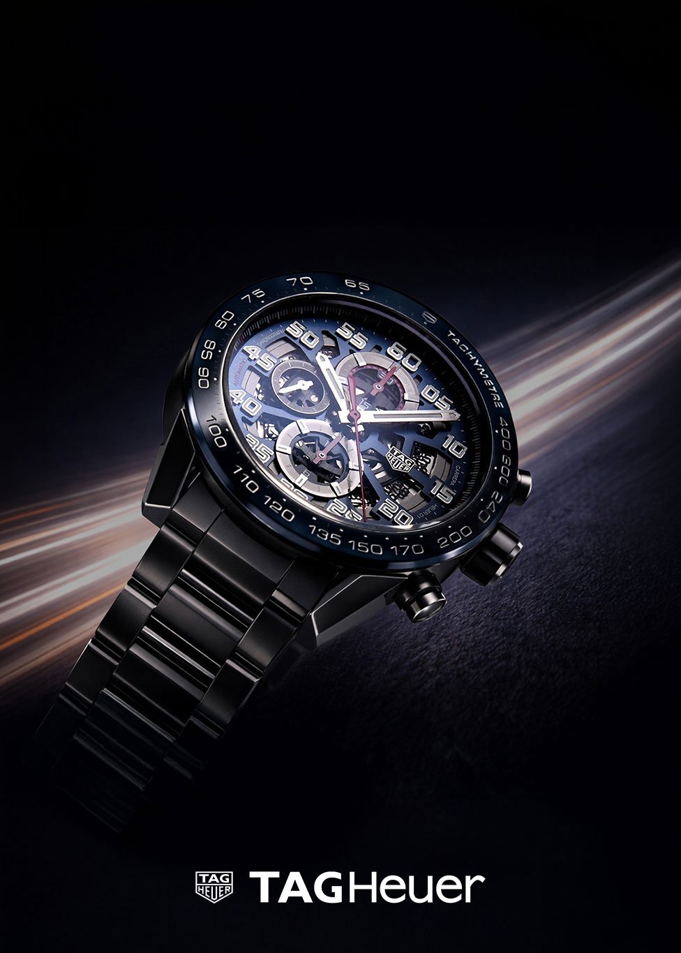 A pre-owned TAG Heuer watch with a black tachymetre bezel and steel bracelet
