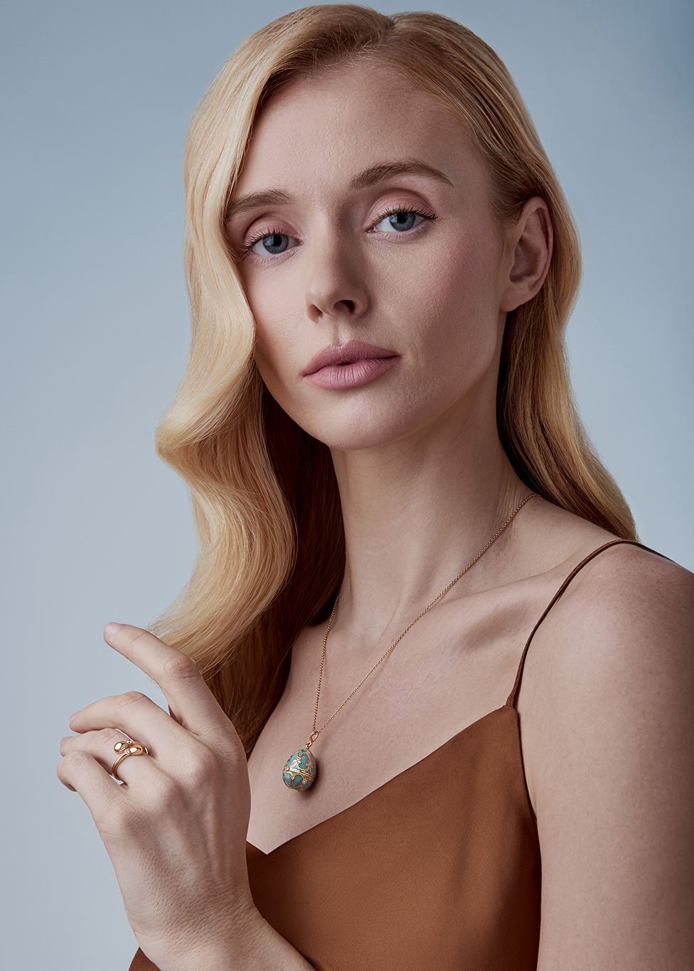 A model wears a Faberge pendant necklace
